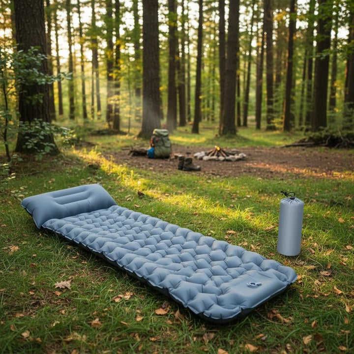 Unisex inflatable camping mattress with built-in foot pump, ideal for hiking and backpacking adventures.