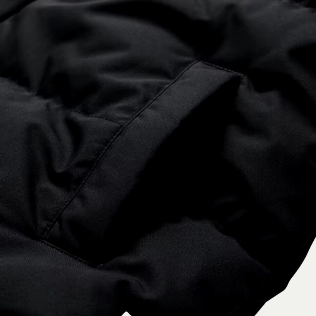 Heavy-duty unisex insulated parka jacket with a cozy hood, designed for harsh winter conditions.
