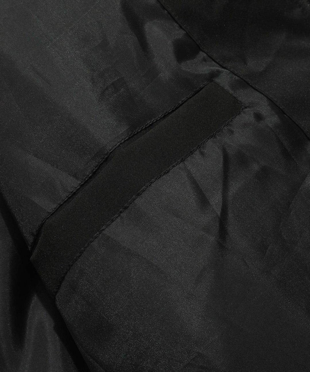 Close-up of the insulated material within a cutaway of the unisex puffer vest, showing warmth technology.