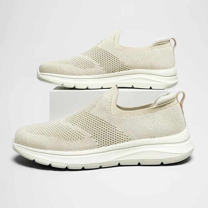 Front view of a unisex knit slip-on sneaker, showcasing its streamlined and casual design.