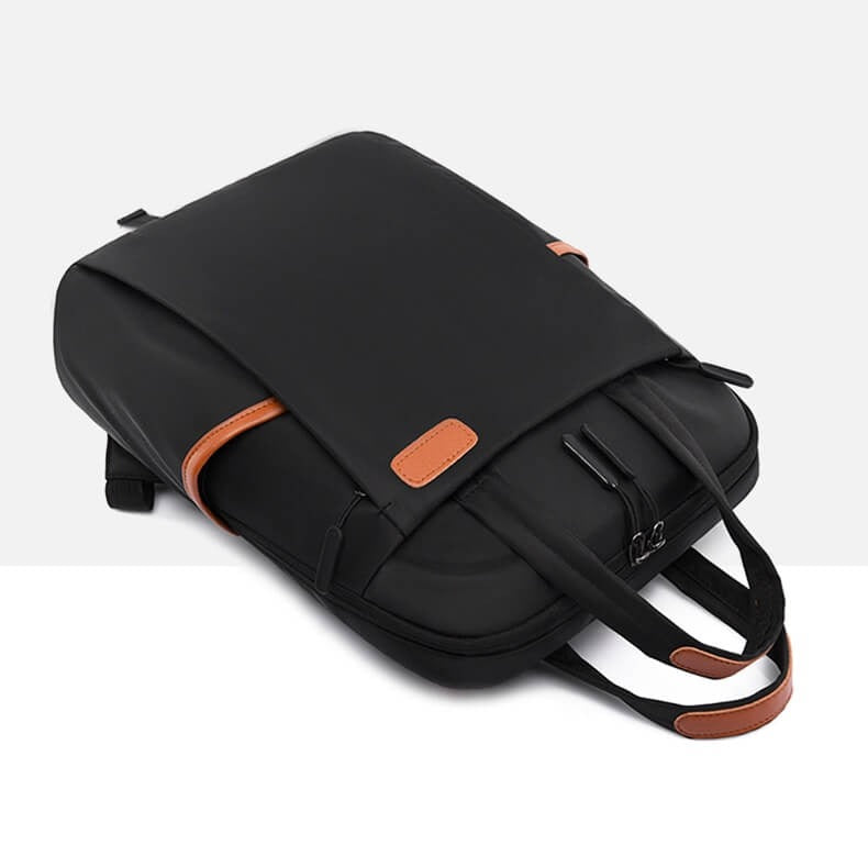 Sleek Oxford fabric anti-theft daypack, lightweight and water-resistant for urban travel.