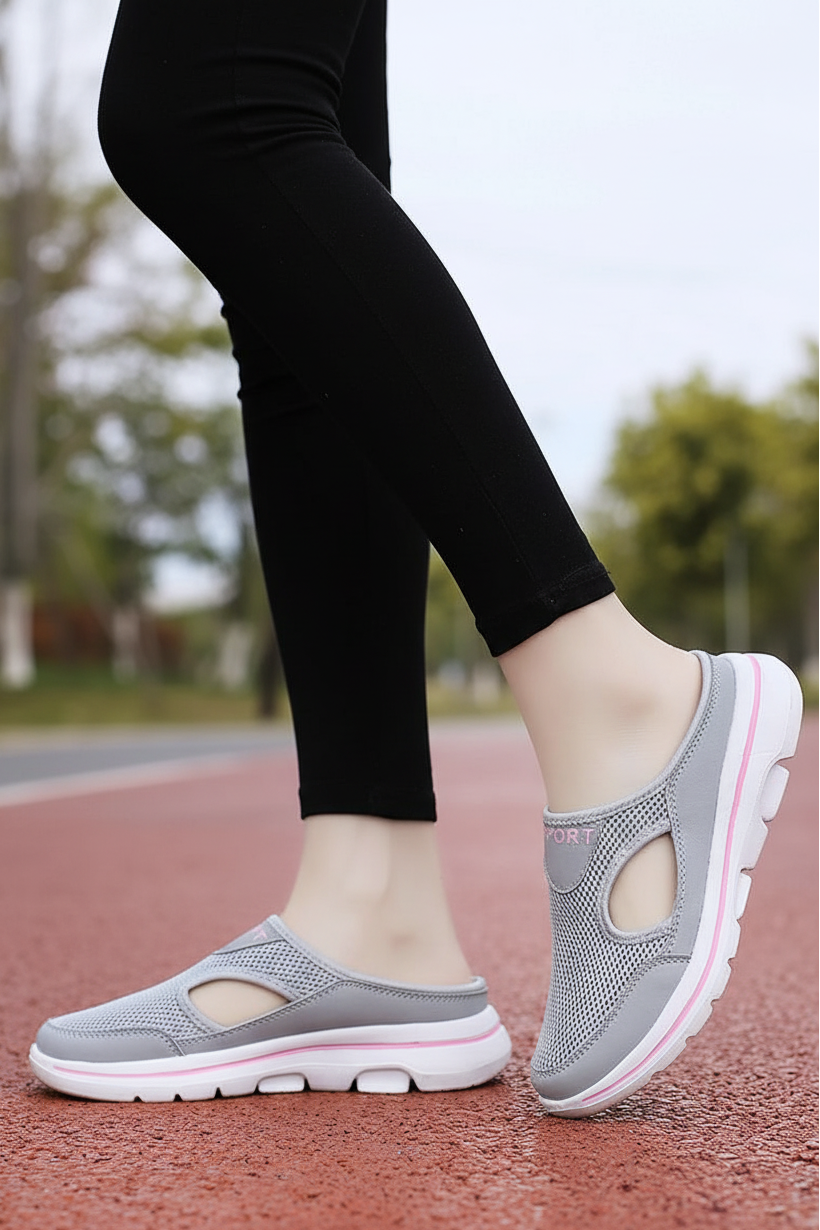 Person wearing Unisex Lightweight House Shoes, demonstrating their easy slip-on design and indoor comfort.