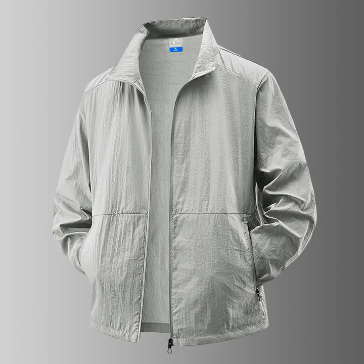 Detail of the zipper and hood on a unisex activewear jacket, offering sun and UV protection