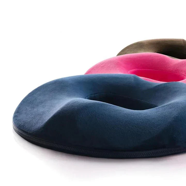 Unisex memory foam donut seat cushion for hemorrhoid and tailbone pain relief. Ergonomic coccyx support.
