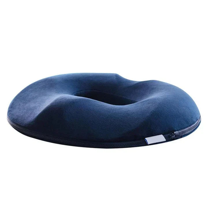 Circular donut cushion with hole for hemorrhoid & tailbone pain relief. Soft memory foam, pressure-relieving support.