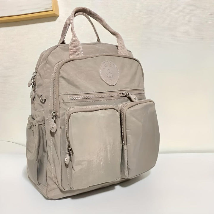 Stylish unisex multi-pocket backpack with ample storage for school, work, or travel.