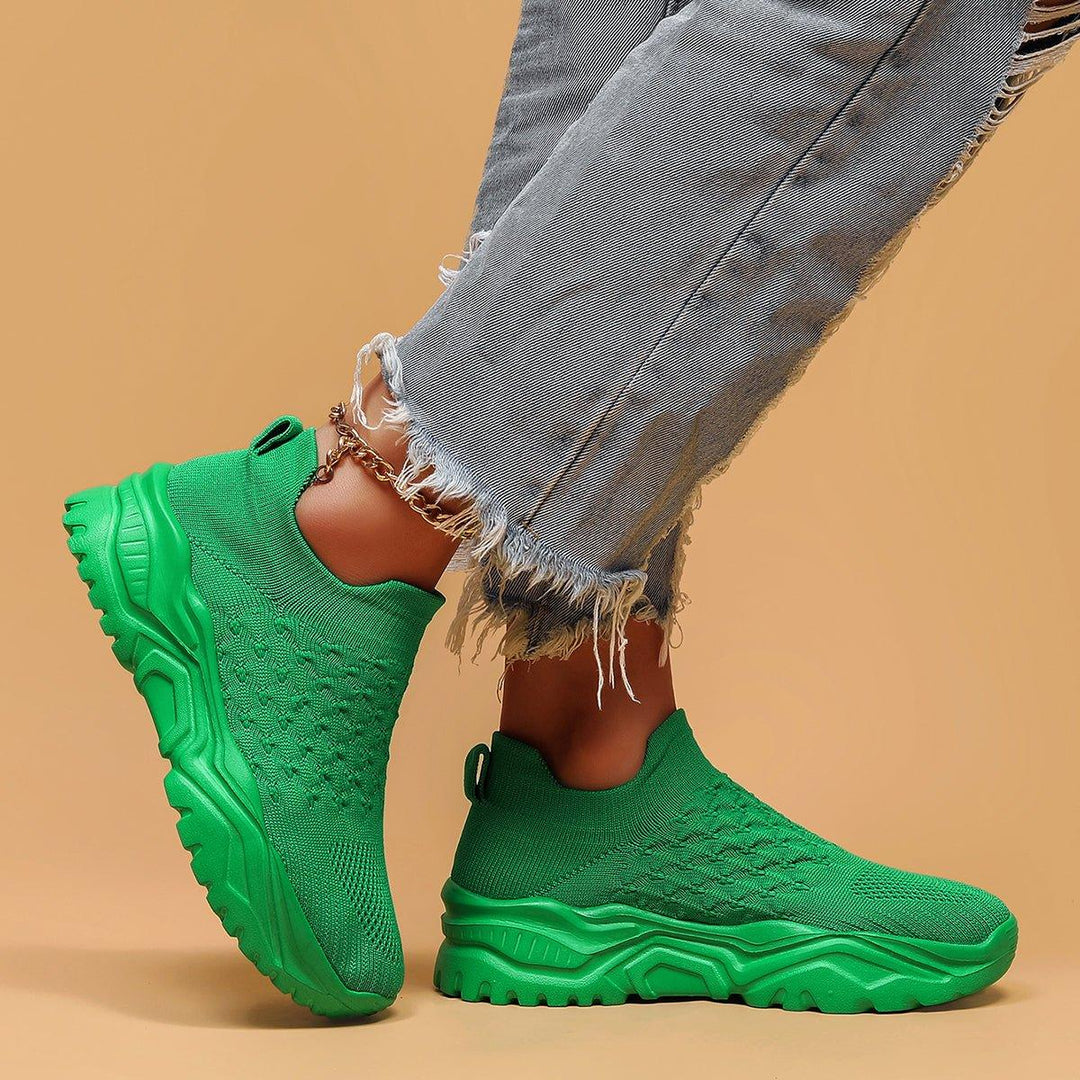 User wearing the green Unisex Ortho Cloud Slip-On Shoes, demonstrating their casual and versatile style