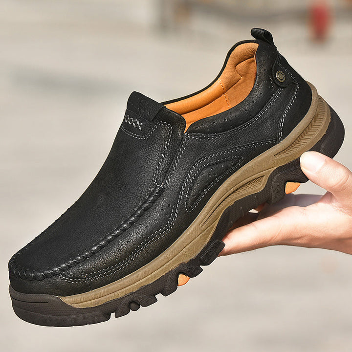 Model walking in black Unisex Orthopedic Transition Boots, showing their comfortable stride.