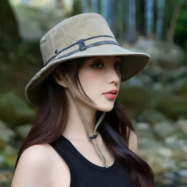 Unisex outdoor bucket hat with adjustable chin strap for sun protection during hiking, fishing, or travel.