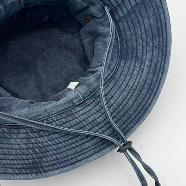 Durable unisex outdoor bucket hat, adjustable and collapsible, offering essential sun protection for all activities.