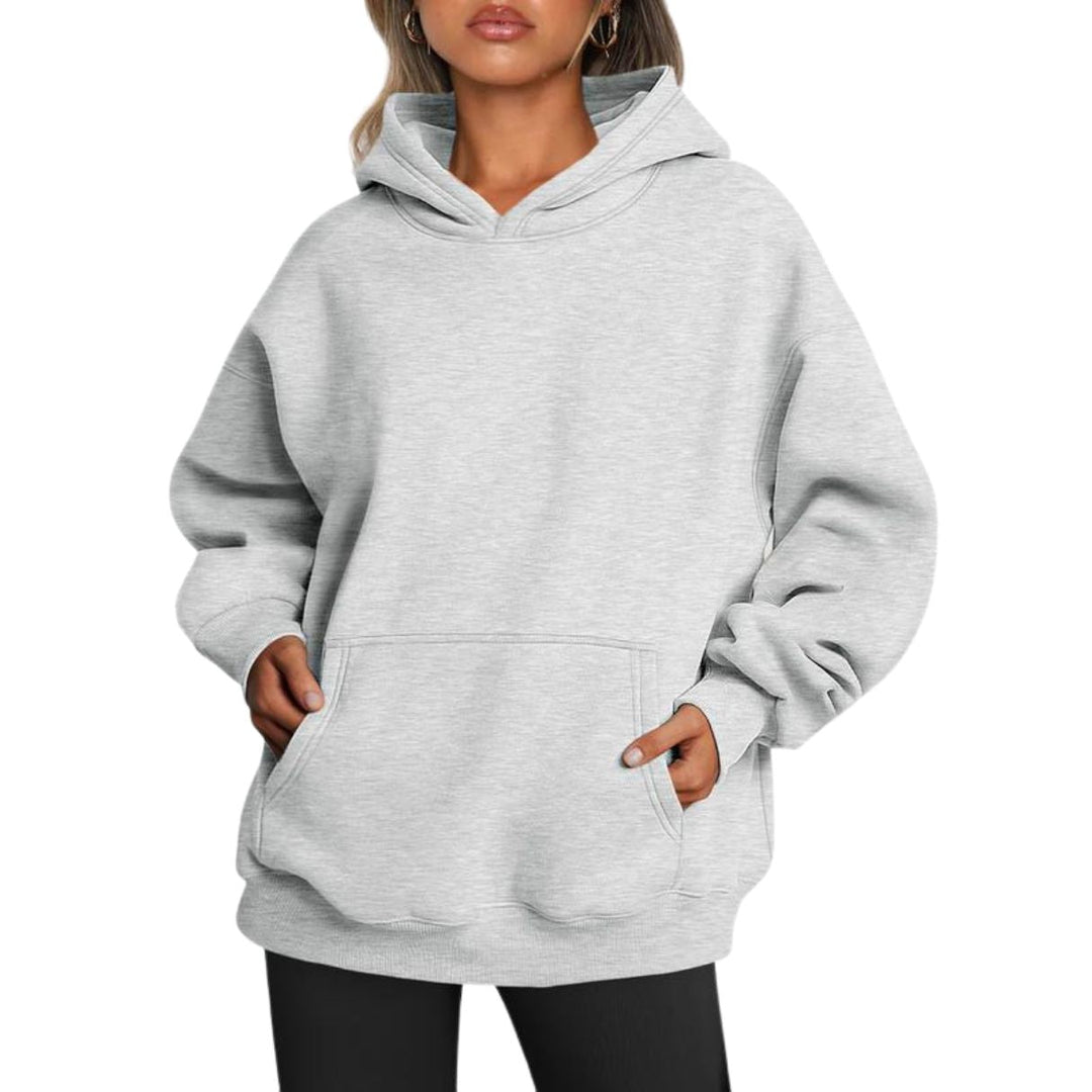 Detailed view of the spacious hood and front pocket of the cozy unisex oversized hoodie in a versatile color