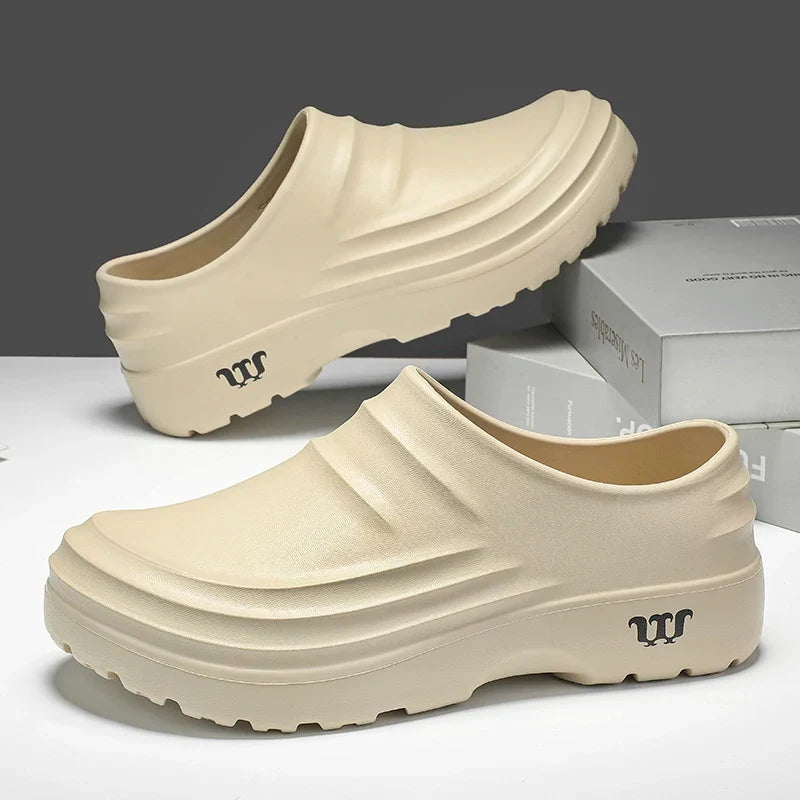 Close-up of the sole of a non-slip work clog, showing tread for superior grip and safety in wet conditions.