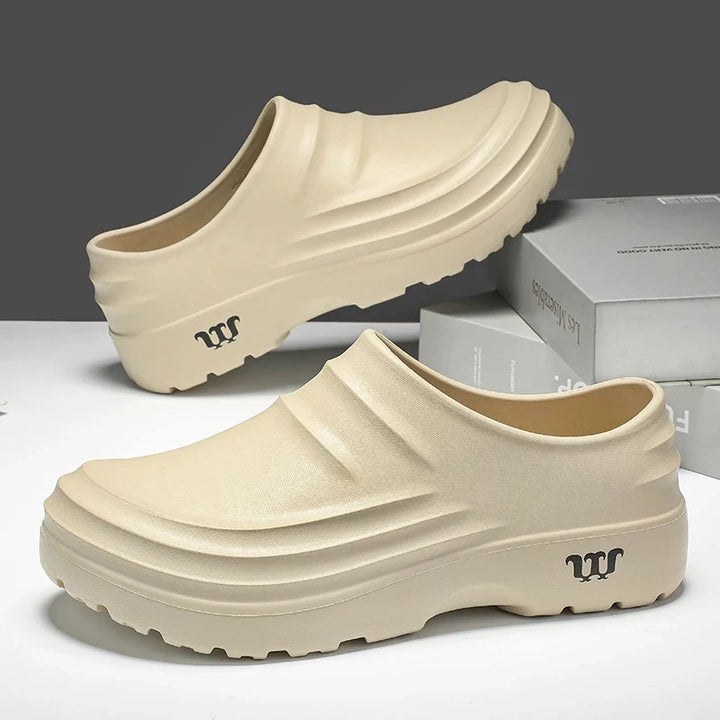 Close-up of the sole of a non-slip work clog, showing tread for superior grip and safety in wet conditions.