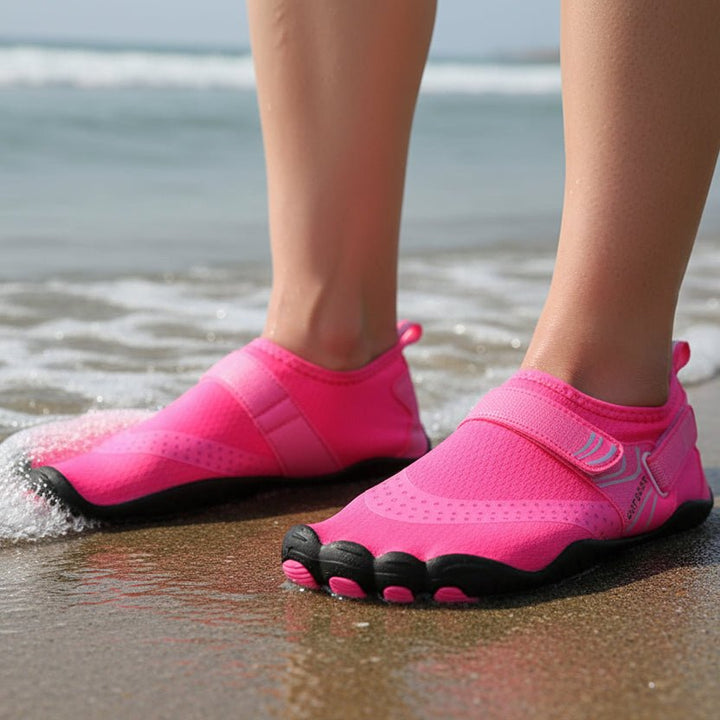 Non-slip grip sole on black unisex water shoes, essential for safe beach, swim & outdoor water sports.