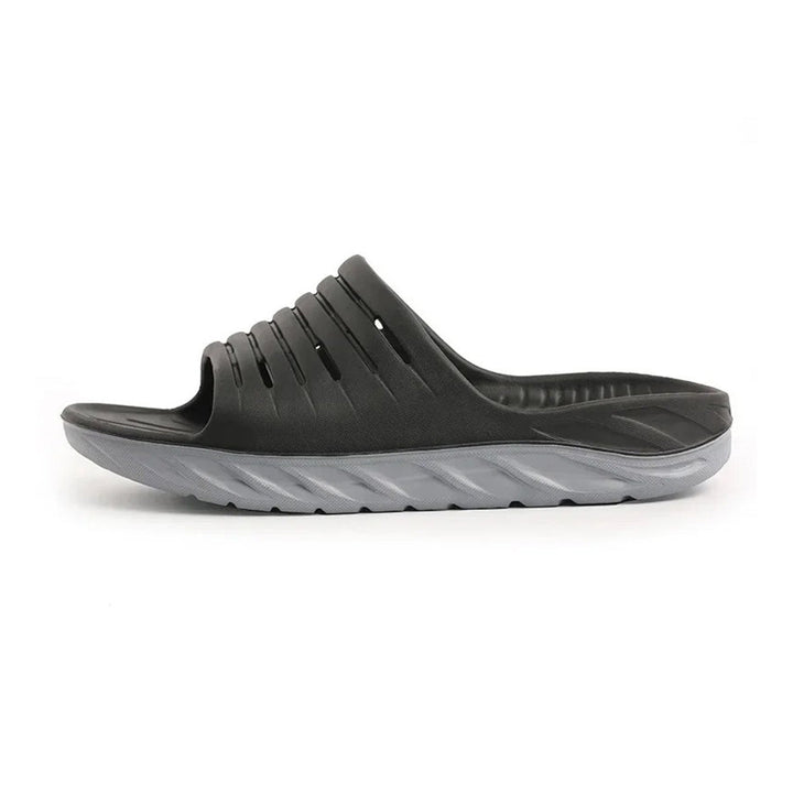 Unisex recovery slides for foot pain relief, arch support, and plantar fasciitis. Comfortable daily wear.