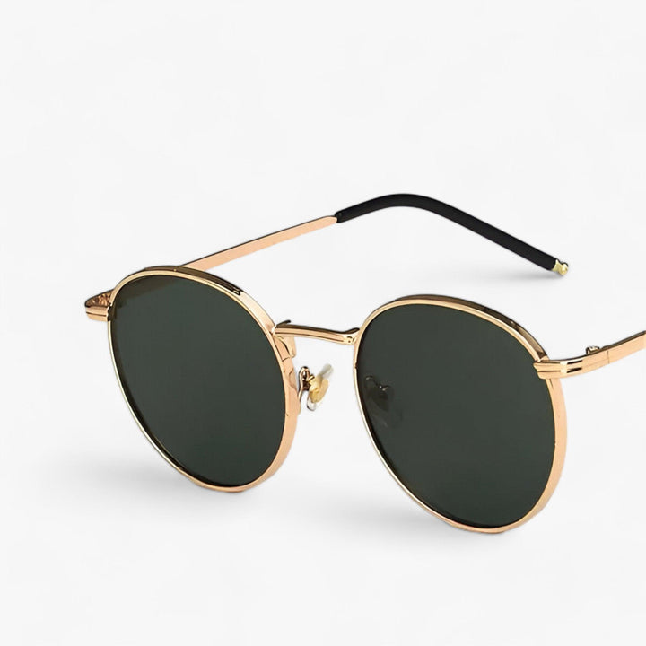 Stylish gray round sunglasses, unisex, featuring a sleek metal frame & UV protection. Ideal outdoor eyewear.