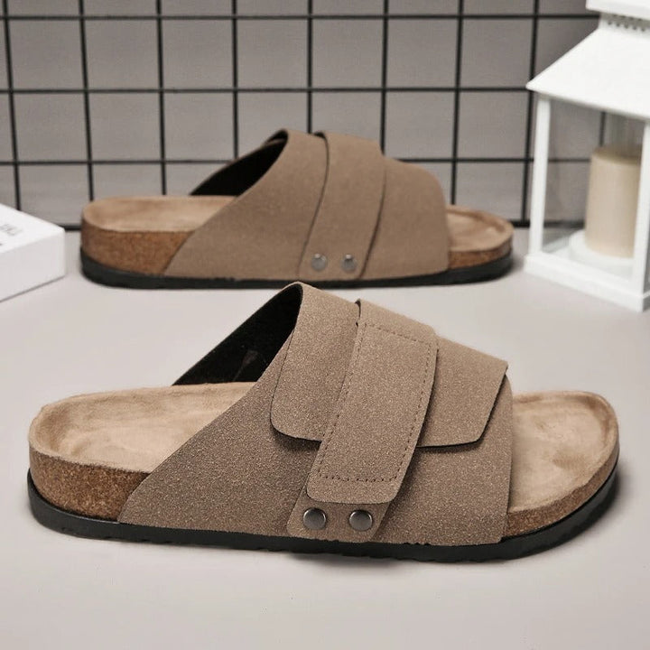 Close-up of the Shoreline Comfort Slide Sandals, showing the leather strap and cushioned sole.