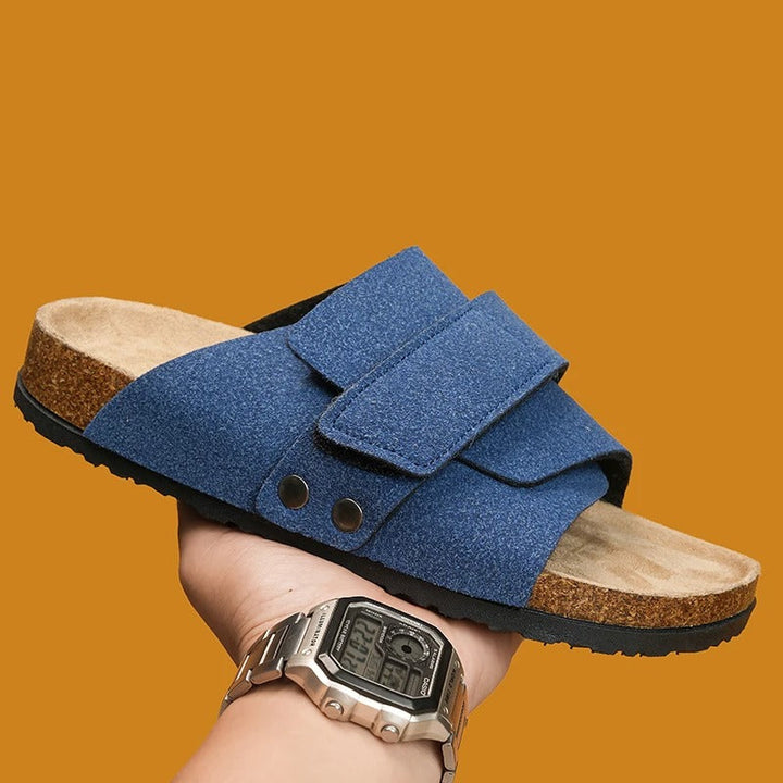 Feet wearing Shoreline Comfort Slide Sandals, demonstrating a relaxed fit for beach and summer activities.
