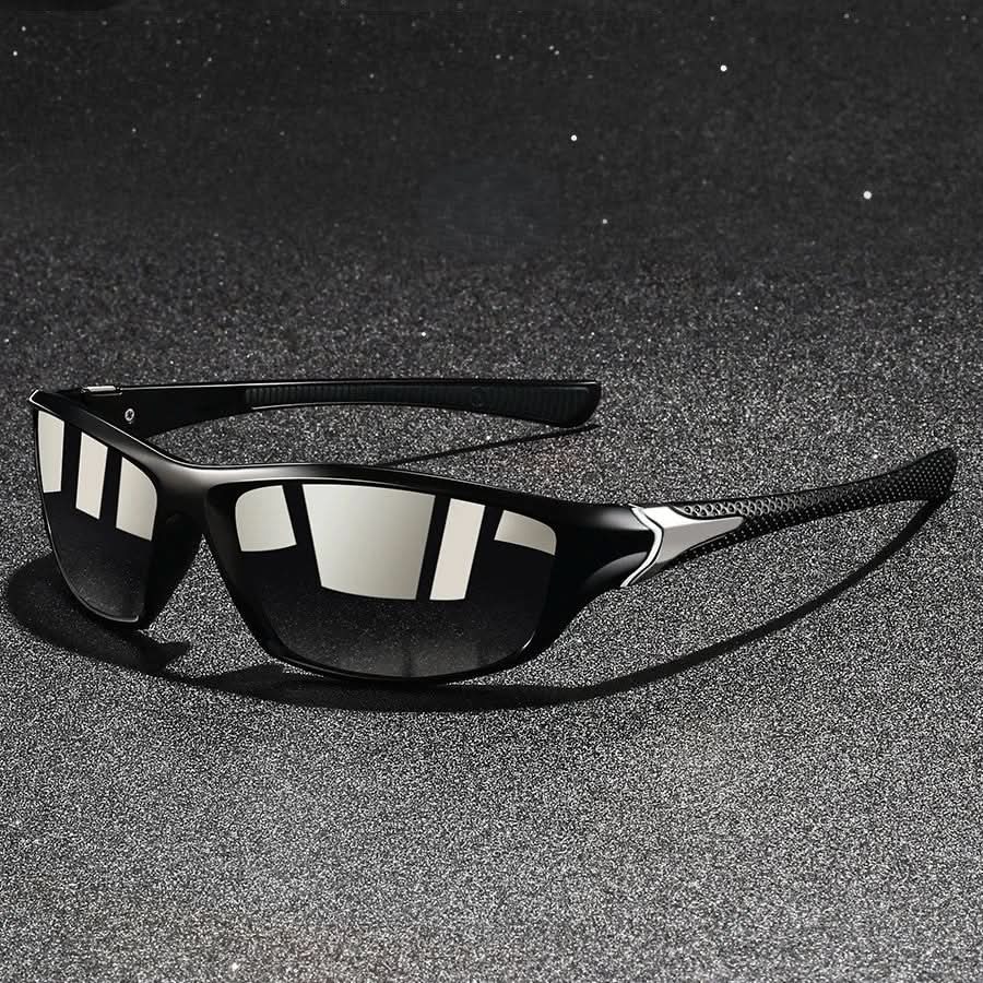 Close-up of durable orange sports sunglasses, showing UV400 protection & athletic, glare-reducing design.