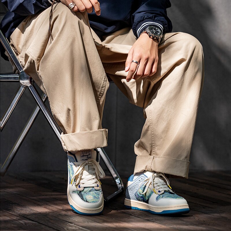 Close-up of vibrant Starry Night pattern on unisex sneakers. Artistic Van Gogh shoes with unique creative footwear.
