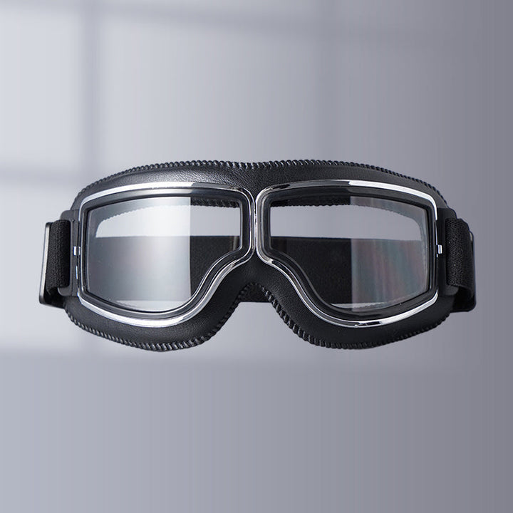 Unisex vintage motorcycle goggles with clear lens for eye protection during rides. Retro styling.