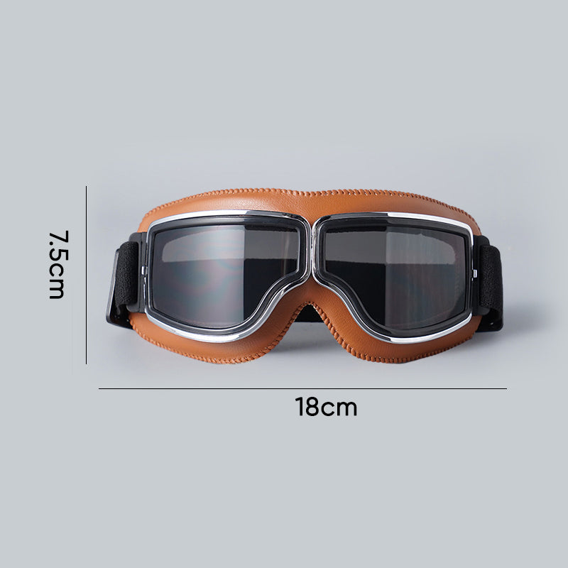 Retro motorcycle goggles, black frame, clear lens. Perfect vintage protection for riders & bike enthusiasts.
