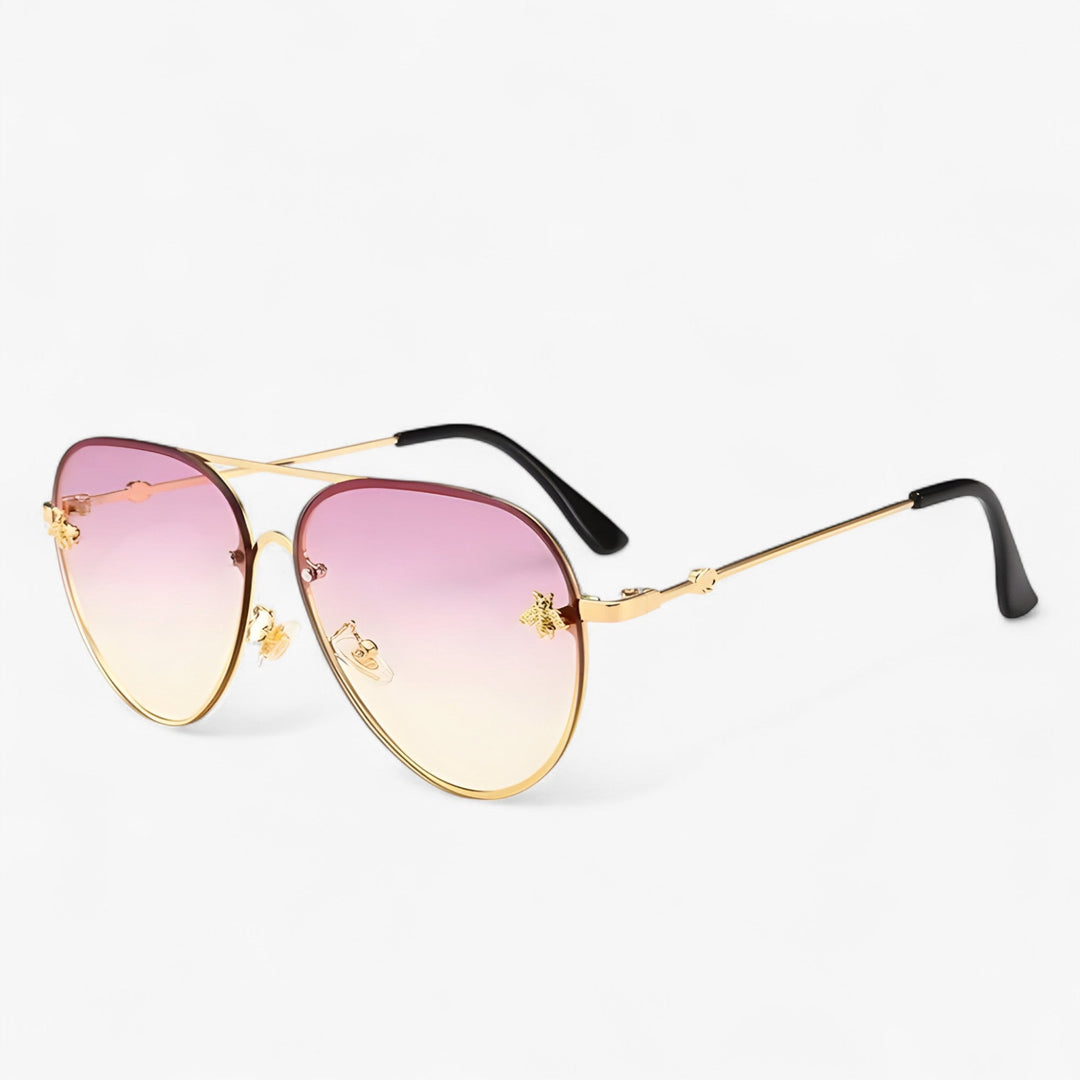 Gold frame vintage aviator sunglasses featuring a detailed bee emblem on the temple, classic eyewear.