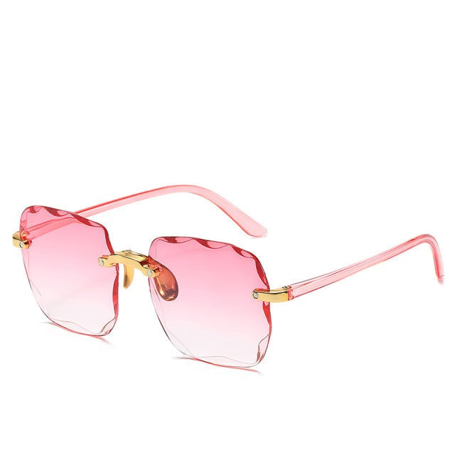 Close-up of stylish unisex vintage rimless sunglasses featuring trendy design and essential UV400 protection.