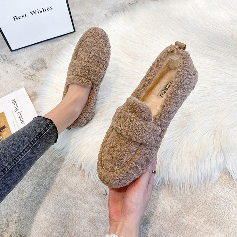 Plush unisex winter slippers, perfect warm indoor footwear for ultimate comfort.