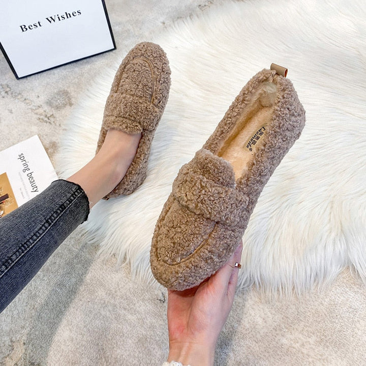 Plush unisex winter slippers, perfect warm indoor footwear for ultimate comfort.
