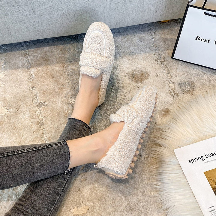 Comfortable unisex home slippers, ideal warm footwear for winter coziness.