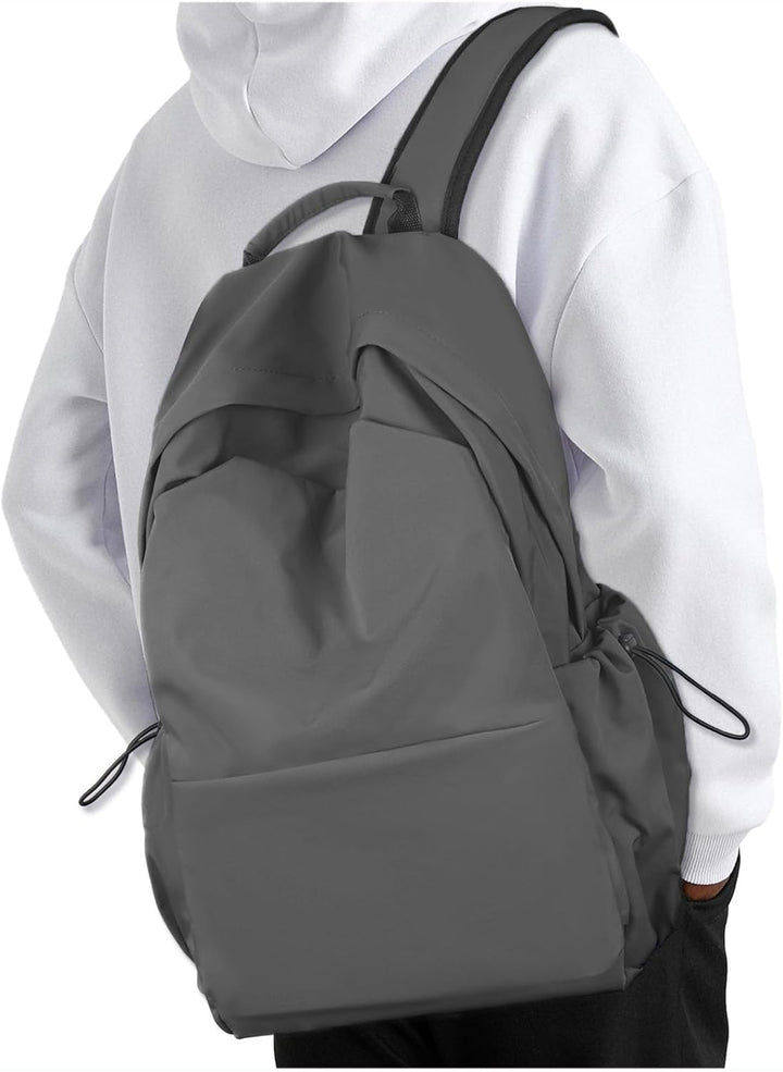 Stylish unisex water-resistant backpack, modern design, organized for daily use & travel.