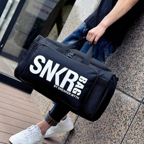 Unisex water-resistant travel bag with shoe compartment & gear storage for sports & gym.