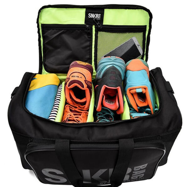 Compact water-resistant travel duffel for sneakers & essentials, ideal for organized journeys.