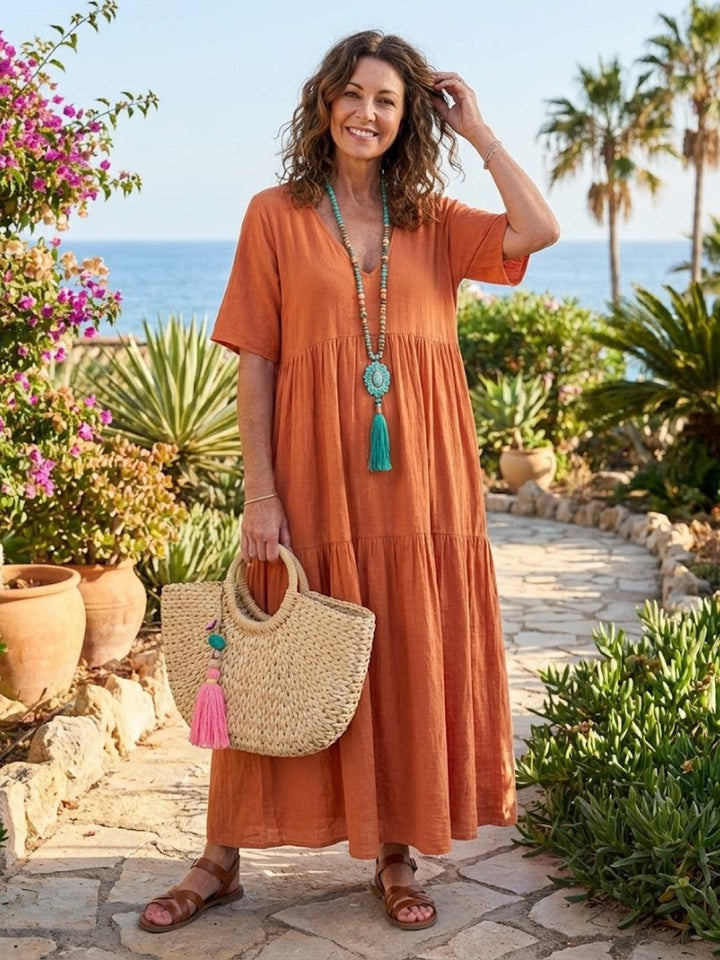 Flowy tiered V-neck maxi dress for women, casual summer style, comfortable & airy.
