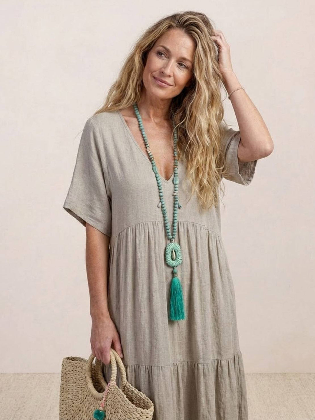 Flowy V-neck tiered maxi dress, women's bohemian fashion for summer and travel.