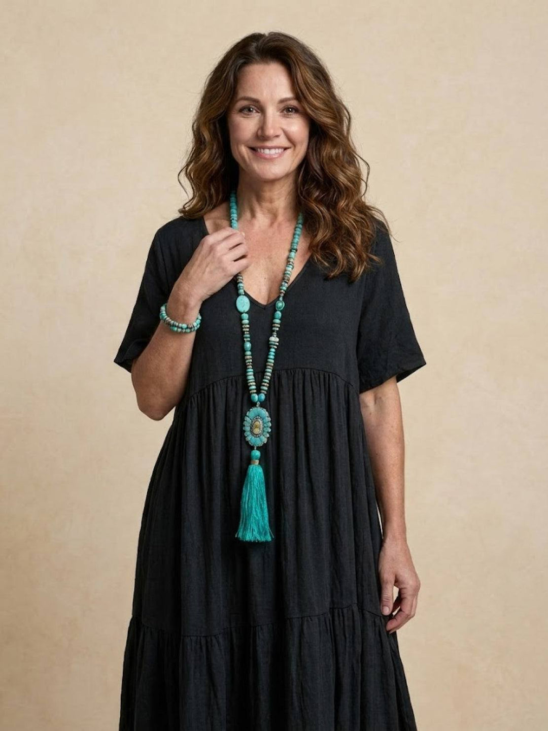 Women's resort V-neck tiered maxi dress, elegant flowy bohemian vacation attire.