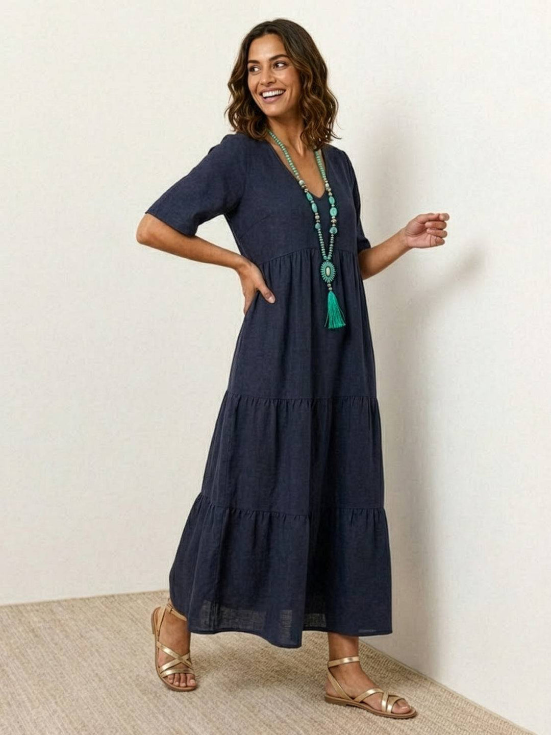 Women's summer V-neck tiered boho maxi dress, airy fabric for beach & casual outings.