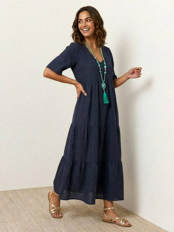 Women's summer V-neck tiered boho maxi dress, airy fabric for beach & casual outings.