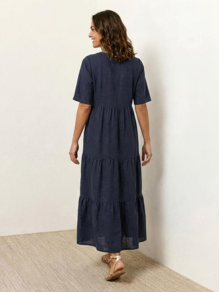 Women's elegant tiered V-neck maxi dress, bohemian flair, perfect for evenings out.