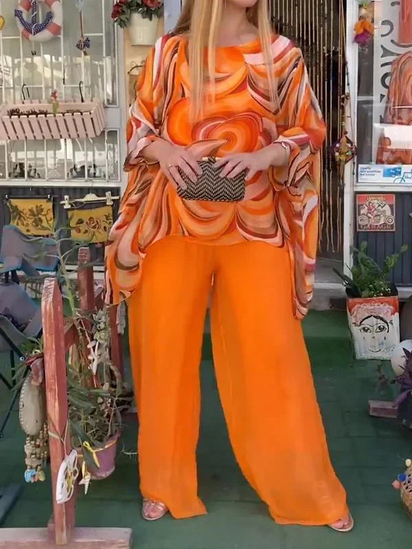 Daytime chic women's abstract print co-ord set: comfortable batwing top & relaxed wide leg pants for stylish summer.