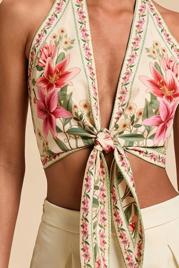 Women's summer halter top with vibrant floral print. Perfect vacation outfit.