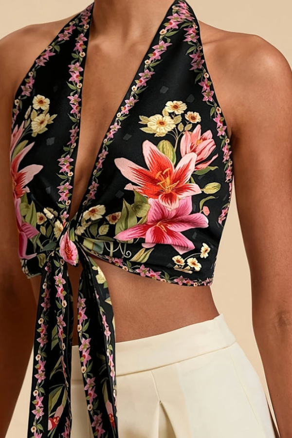 Eye-catching vibrant floral print women's halter top. Trendy summer style.