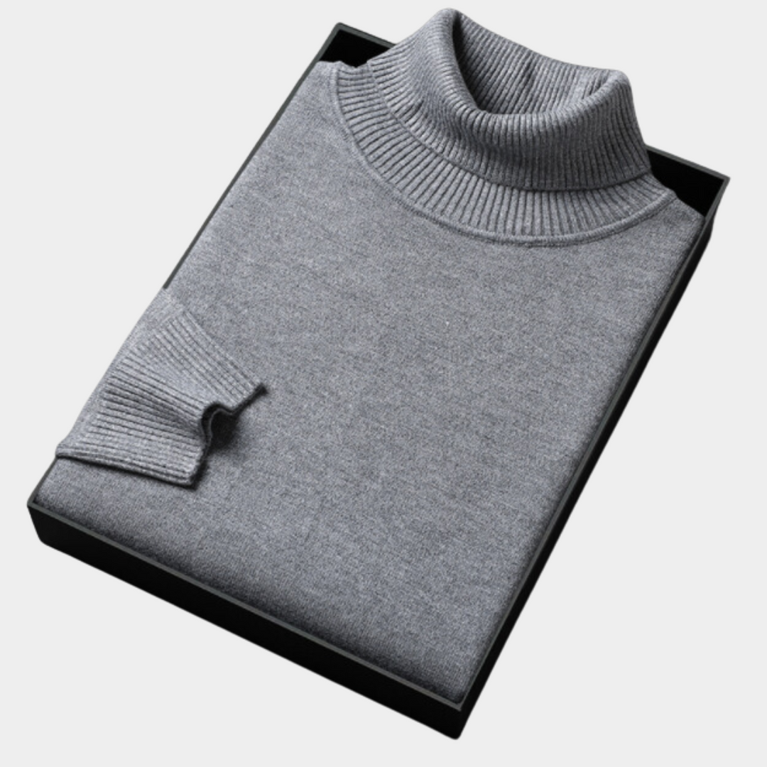 Confident men's vibrant turtleneck sweater, showcasing bold and modern knitwear style.