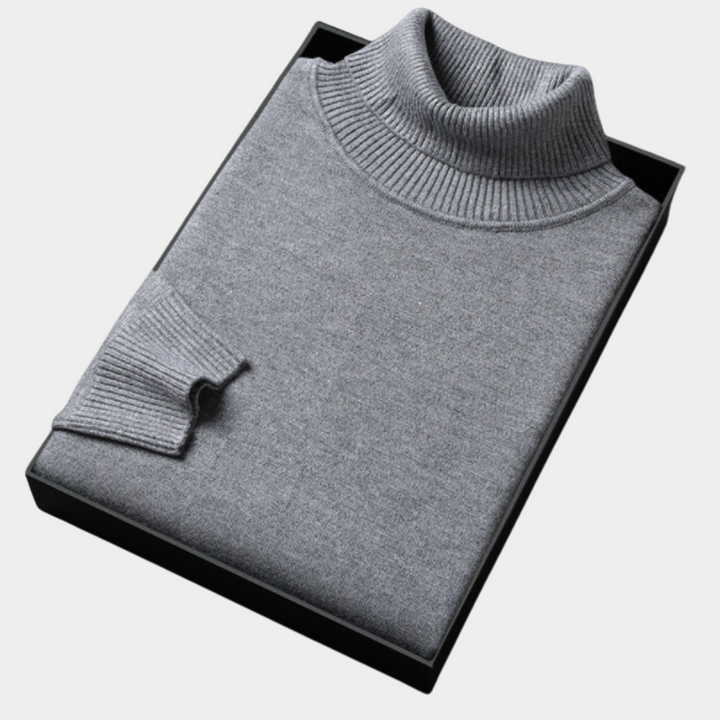 Confident men's vibrant turtleneck sweater, showcasing bold and modern knitwear style.