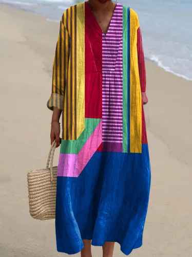 Elegant V-neck long-sleeve women's maxi dress with colorful patchwork. Comfortable flowy design for summer fashion.