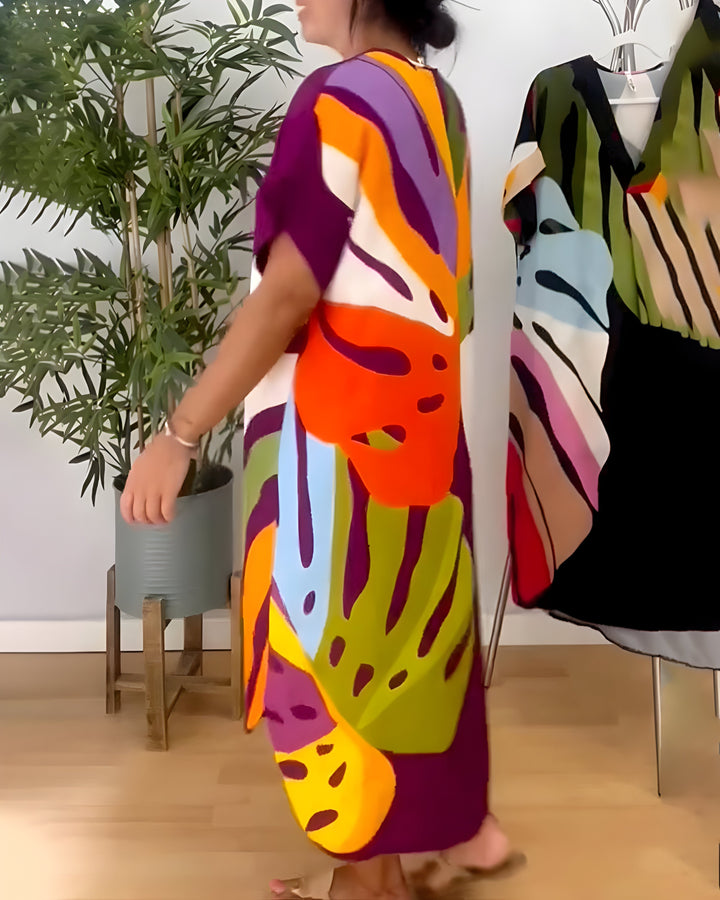 V-neck women's shift dress featuring a unique abstract print. Short sleeve, relaxed fit, and vibrant for summer style.