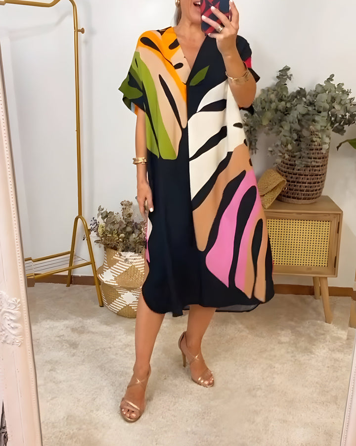 Women's chic abstract print V-neck shift dress, featuring short sleeves and a comfortable relaxed fit for summer.