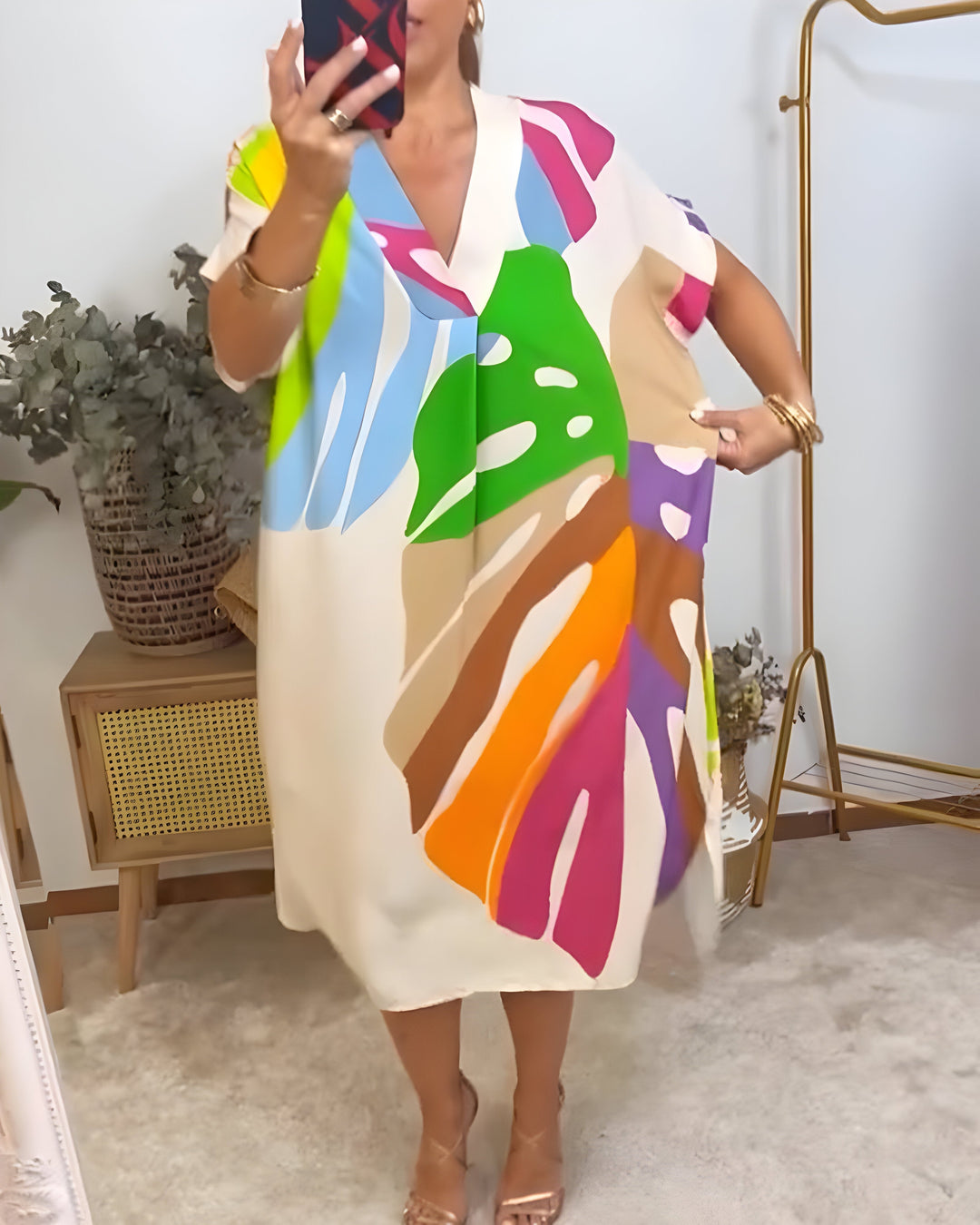 Women's elegant abstract print V-neck shift dress. Short sleeve, relaxed fit, and vibrant for a statement look.