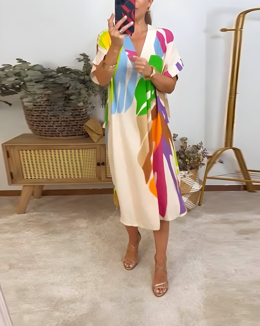 Summer fashion women's abstract print V-neck shift dress. Short sleeve, relaxed fit, and colorful for casual wear.